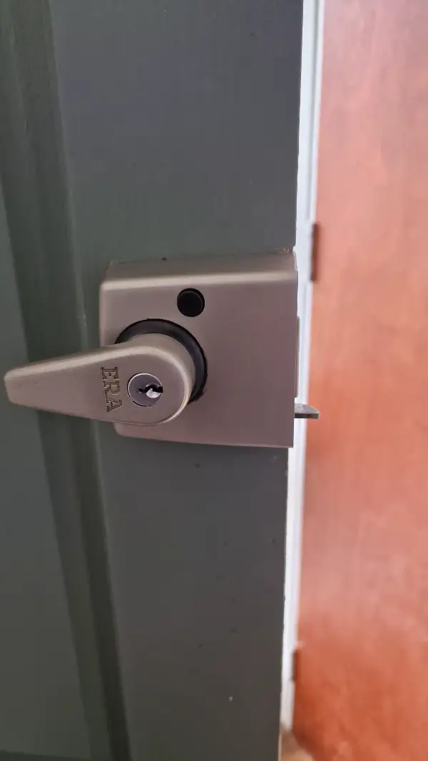 ERA night latch door lock professionally fitted to a timber entrance door in Forest Hill, London.